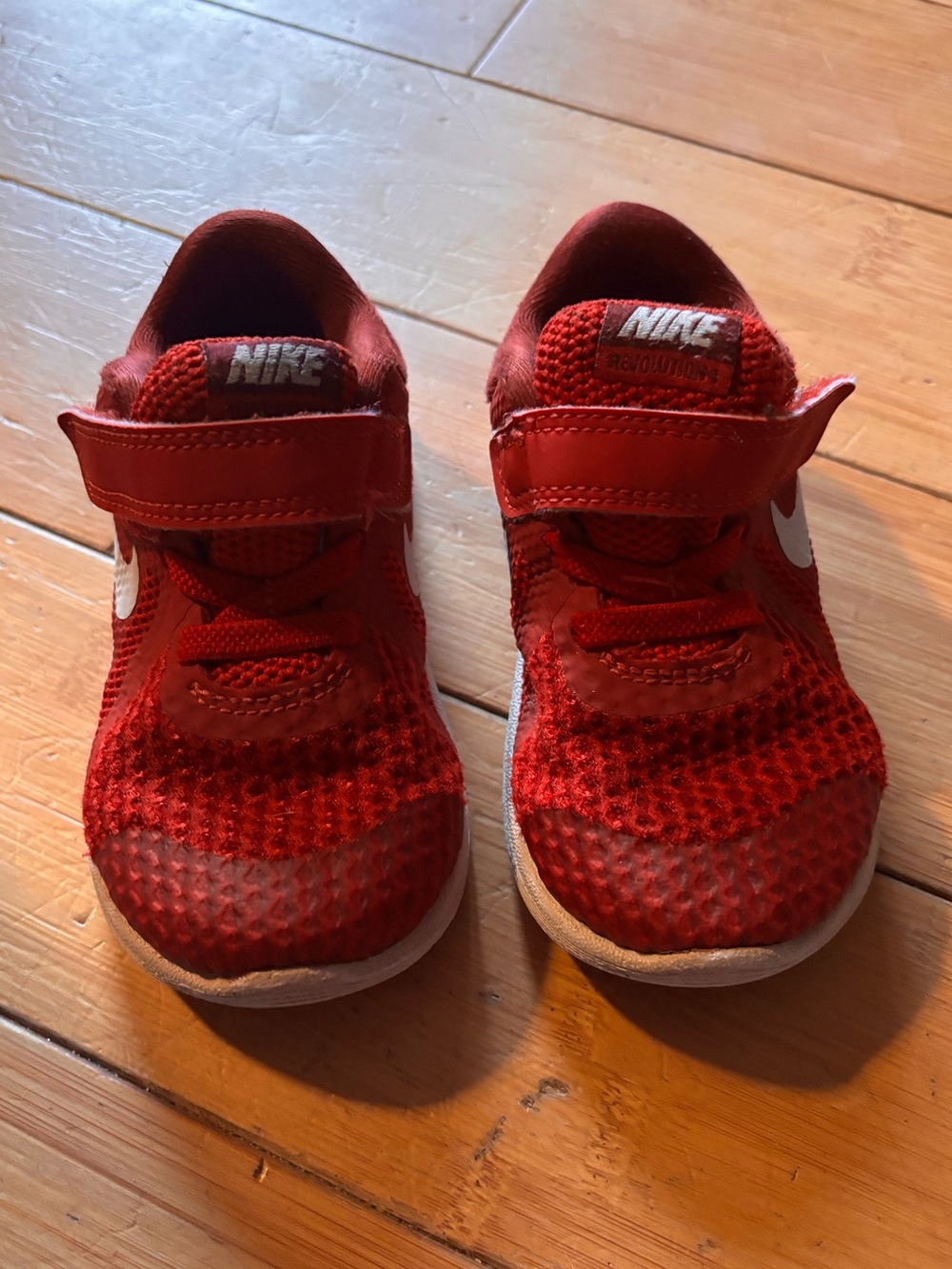 Nike sneakers. Toddler size 7. Velcro closure .